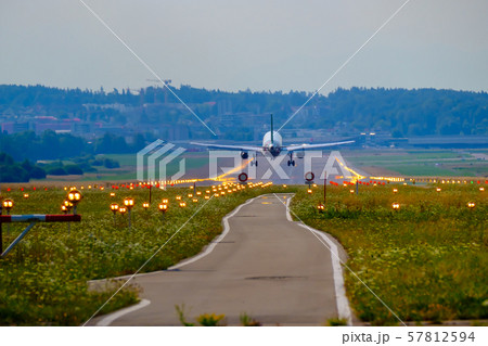 Airplane landing at airport runway Airplane landing at airport runway 57812594