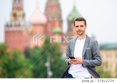 Happy young urban man in european city. 57812724