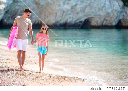 Beautiful father and daughter on european beach 57812897