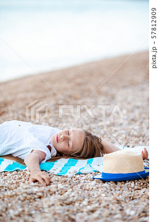 Cute little girl at beach during summer vacation 57812909
