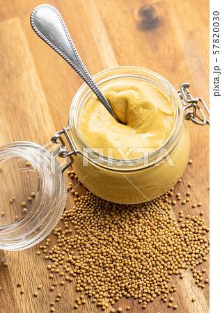 The yellow mustard in jar. 57820030