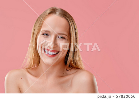 Beautiful girl smiling looking straight forward 57820056