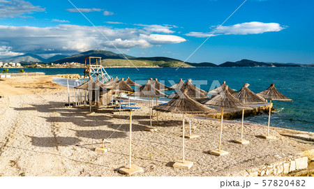 Straw umbrellas on a beach in Saranda, Albania 57820482