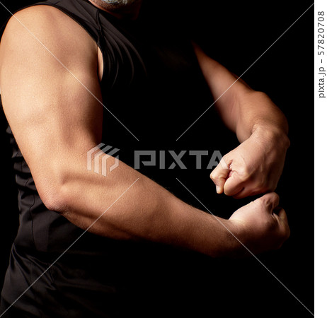 adult man with a sports figure in black clothes 57820708