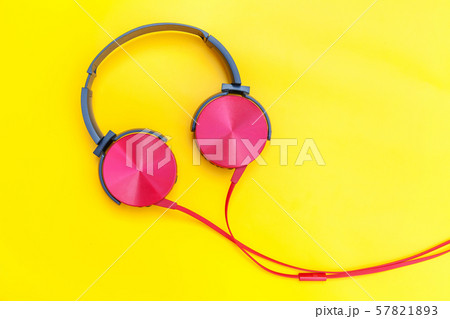 Red headphones with cable isolated on yellow 57821893