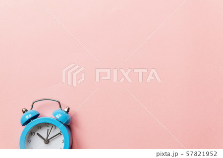 Vintage alarm clock Isolated on pink pastel Vintage alarm clock Isolated on pink pastel 57821952