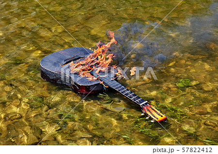 They set the guitar on fire and put it in water. 57822412