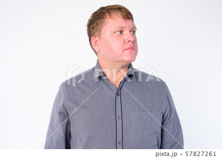 Face of overweight businessman thinking and looking up Face of overweight businessman thinking and looking up 57827261