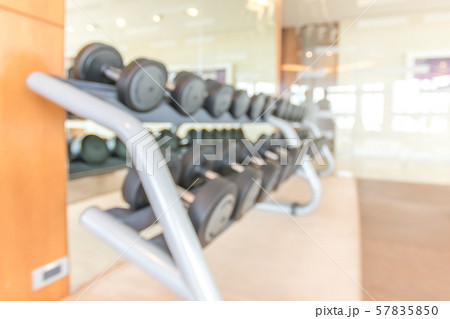 Blur gym background fitness center or health club with blurry sports exercise equipment for aerobic workout and bodybuilding 57835850