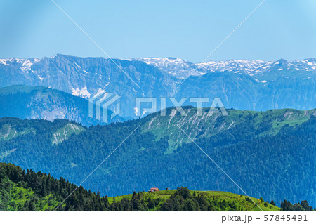 Green mountain ridges, surrounded by mountains Green mountain ridges, surrounded by mountains 57845491