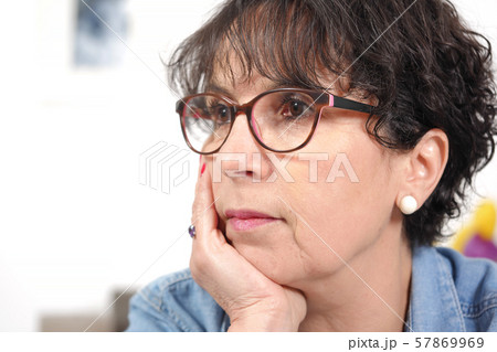 portrait of brunette mature woman with glasses 57869969