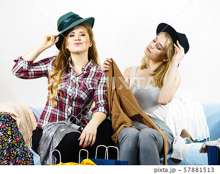 Two happy female friends after shopping 57881513