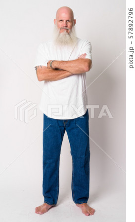 Full body shot of mature bald bearded man with arms crossed 57892796