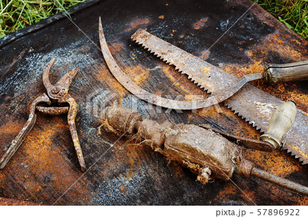 Rusty tools on the rusty sheet 57896922