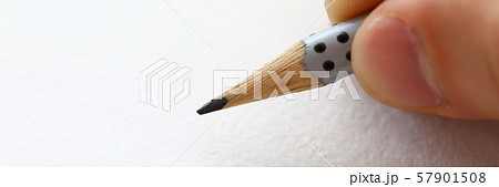 Male hand holding grey simple pencil Male hand holding grey simple pencil 57901508
