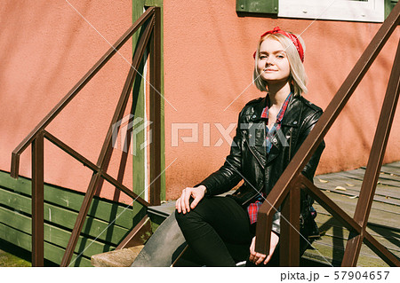 Teenage female hipster in a biker jacket 57904657