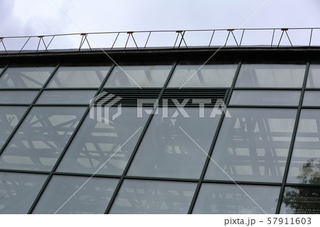 Glass facade of the greenhouse for tropical plants Glass facade of the greenhouse for tropical plants 57911603