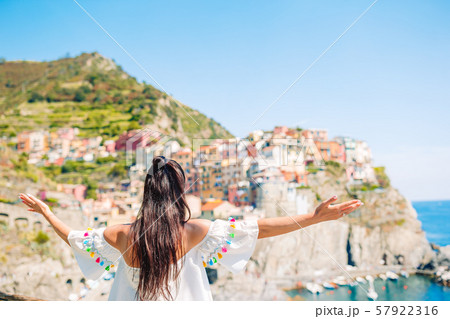 Tourist looking at scenic view of Manarola, Cinque Terre, Liguria, Italy Tourist looking at scenic view of Manarola, Cinque Terre, Liguria, Italy 57922316
