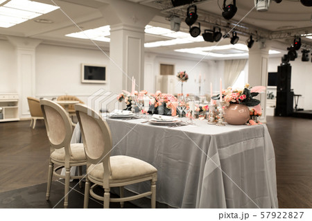 The white table in the restaurant is decorated The white table in the restaurant is decorated 57922827
