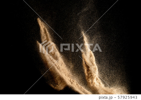 Dry river sand explosion isolated on black background. Abstract sand cloud.Brown colored sand splash against dark background. 57925943