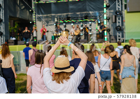 Couple is watching concert at open air music festival 57928138