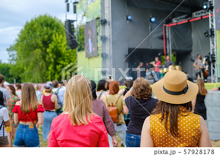 Couple is watching concert at open air music festival Couple is watching concert at open air music festival 57928178