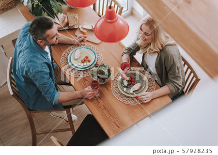 Happy wife and husband having dinner at home 57928235