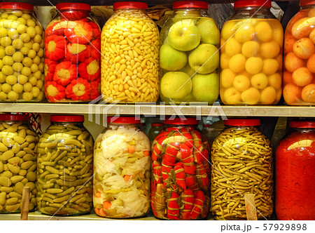 Pickled vegetables in glass jars on the market. Pickled vegetables in glass jars on the market. 57929898