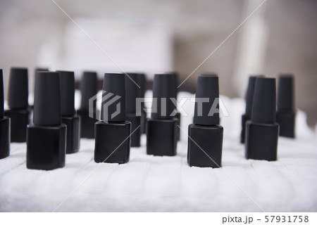 Stylish gel polishes standing on table at beauty salon Stylish gel polishes standing on table at beauty salon 57931758