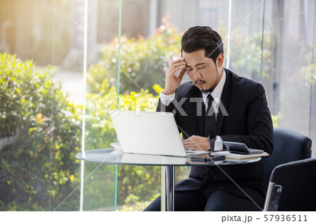 stressed business man using laptop and working stressed business man using laptop and working 57936511