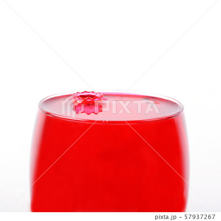 Pouring red wine in glass Pouring red wine in glass 57937267