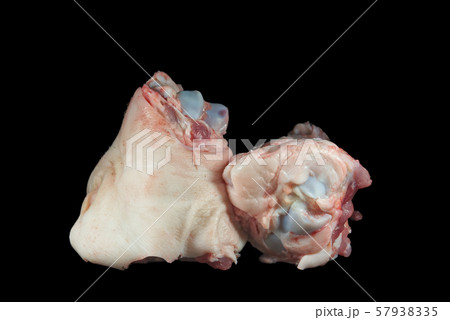 Two raw knuckle or joint bones on black 57938335
