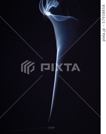 Aromatic stick smouldering with white smoke 57938658