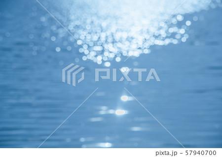 Bokeh on the water surface the background. Bokeh on the water surface the background. 57940700