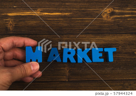 Hand and finger arrange text letters of MARKET 57944324
