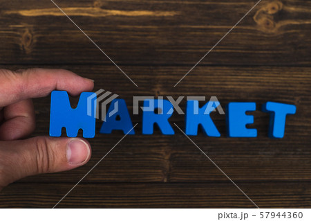 Hand and finger arrange text letters of MARKET 57944360