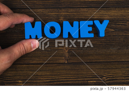 Hand and finger arrange text letters of MONEY word Hand and finger arrange text letters of MONEY word 57944363
