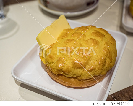 Buttered pineapple bun in dish Buttered pineapple bun in dish 57944516