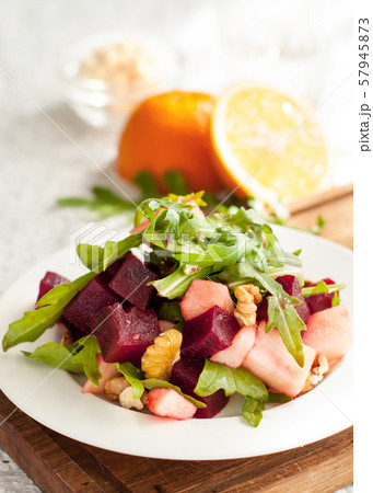 Salad with apple, beet, arugula and walnuts 57945873