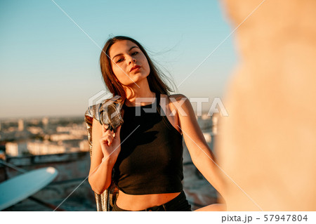 portrait of a young brunette girl in black 57947804