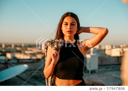 portrait of a young brunette girl in black 57947806