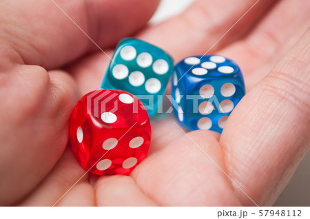 Closeup of colorful dices in hand  57948112