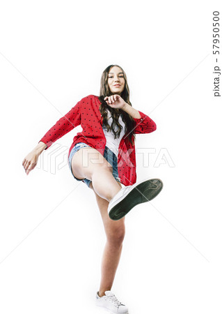 young pretty teenage hipster girl posing emotional happy smiling on white background, lifestyle 57950500