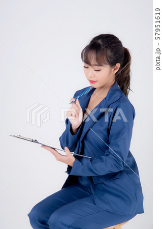 Beautiful portrait young business asian woman thinking and note on clipboard for success isolated 57951619