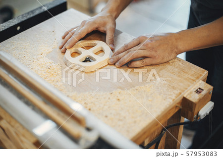 The carpenter works with a tree 57953083