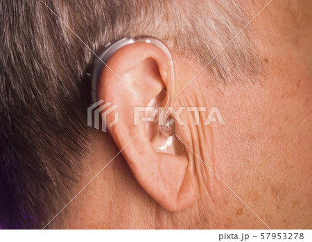 Man with hearing aid Man with hearing aid 57953278