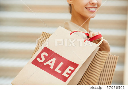Woman with paper bags 57956501