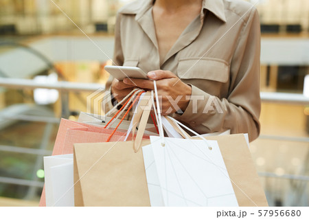 Woman with shopping bags 57956680