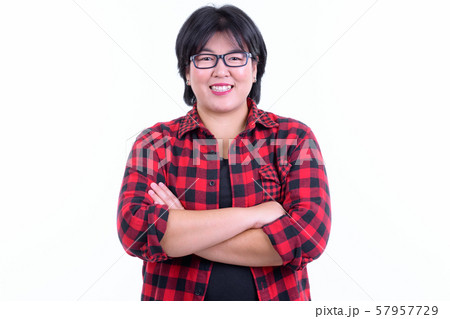 Happy overweight Asian hipster woman smiling with arms crossed 57957729