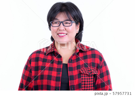 Face of happy overweight Asian hipster woman thinking 57957731